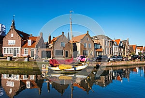 View of Monnickendam old town, Netherlands. Charming canal with boats in Waterland district near Amsterdam.