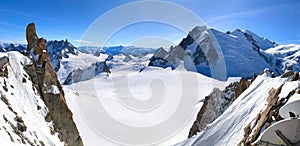 View of the Mont Blanc massif seen from the Aiguille du Midi. French Alps, Europe.