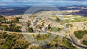 View of Montalcino town in Val d`Orcia, Tuscany, Italy. The town takes its name from a variety of oak tree that once covered the