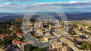View of Montalcino town in Val d`Orcia, Tuscany, Italy. The town takes its name from a variety of oak tree that once covered the
