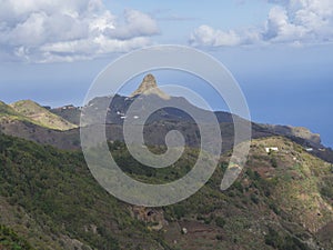 View on Monte Taborno with green hills and blue sky white clouds photo