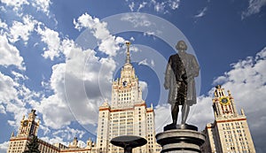 View of the monument to Mikhail Vasilyevich Lomonosov from building of Moscow State University MSU, on the background of the sky,