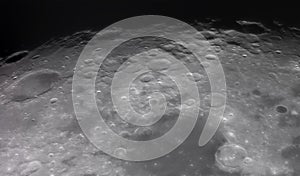 View of the Moon surface, showcasing intricate details of its craters and rugged terrain. The image captures the texture