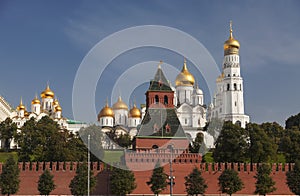 View of the Moscow Kremlin with the Grand Kremlin Palace, cathedrals and the bell tower of Ivan the Great on a sunny summer day