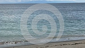 View of Mount Batur in Bali through the strait from the island of Lombok, Indonesia