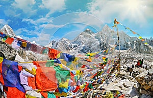 View of Mount Everest and Nuptse with buddhist prayer flags from kala patthar in Sagarmatha National Park