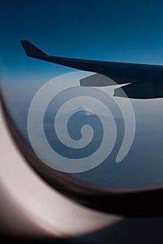 View of Mount Fujiyama Fujii through an airplane window