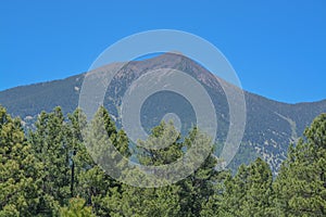 The view of Mount Humphreys and its Agassiz Peak. One of the San Francisco Peaks in the Arizona Pine Forest. Near Flagstaff, Cocon