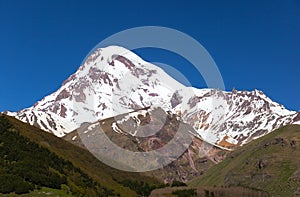 View of Mount Kazbek, near Stepantsminda. Georgia. photo