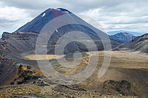 View of Mount Ngauruhoe - Mount Doom from Tongariro Alpine Crossing hike with clouds above