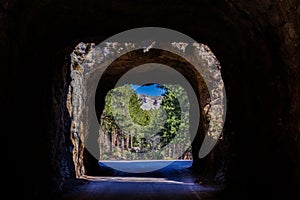 View of Mount Rushmore through C.C. Gideon Tunnel on the Iron Mount Road