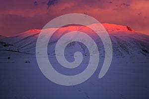 View of mount Vettore during winter sunset in Umbria photo