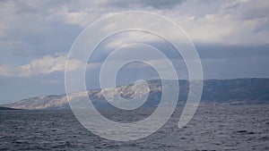 View of the mountain Biokovo in Croatia from a moving ship in the Adriatic Sea