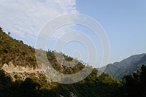 The view of mountain, blue sky, greenery, the beauty of nature of the famous neer waterfall, rishikesh, Uttarakhand, India