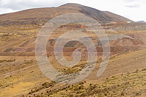 View of the mountain with different colors of soils, some vegetation and the sky in the afternoon, located in Shupluy