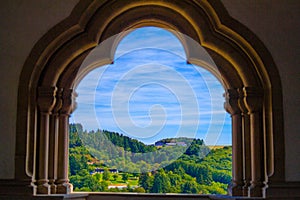 View of the mountain and forest in Vianden, Luxembourg, from an arch inside the Vianden Castle