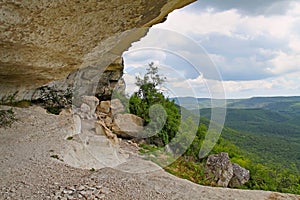 The view from a mountain grotto in the mountains
