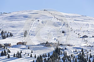 View of the mountain peak with ski lifts in Königsleiten, Austria.