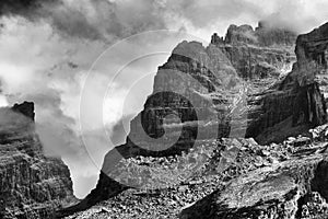 View of the mountain peaks Brenta Dolomites in a foggy autumn day.