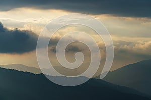 View of a mountain range in the Alps of Europe during sunset. Slopes in Autumn