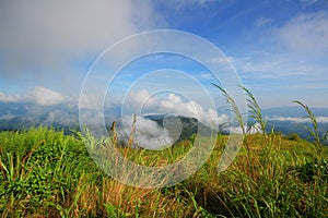 View at a mountain range with morning fog in a mountain valley