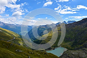 View of mountain ranges in High Tauern mountains with the Stausee Margaritze lake bellow