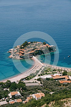 View from the mountain to the beach on the isthmus of the island of Sveti Stefan. Montenegro