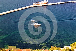 View from the mountain to the harbor of the Turkish resort of Alanya - boat, boat and dry cargo