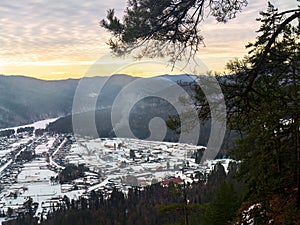 View from the mountain to nature and settlement on a winter day