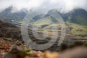 View mountain valley with green, foggy hills. Laugavegur hiking trail, Iceland