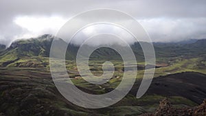 View mountain valley with green, foggy hills. Laugavegur hiking trail, Iceland