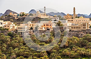 View of mountain village Misfat Al Abriyeen surrounded by the garden with date palms  Sultanate of Oman photo