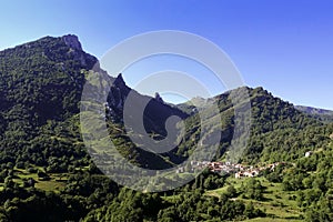 View of a mountain village under a clear blue sky in Cucayo, Liebana, Cantabria, Spain photo