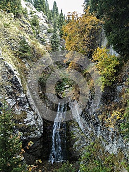 View of a mountain waterfall in summer