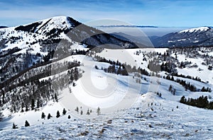 View from the mountain on the winter mountainous landscape