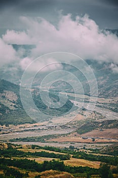 View of mountains Babadag in the clouds and a river Girdimanchay Lahij yolu from the side in Lahic village, Azerbaijan