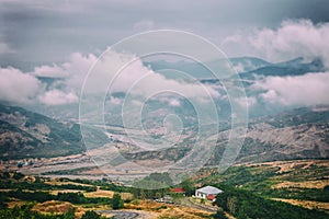 View of mountains Babadag in the clouds and a river Girdimanchay Lahij yolu from the side in Lahic village, Azerbaijan