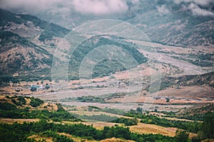 View of mountains Babadag in the clouds and a river Girdimanchay Lahij yolu from the side in Lahic village, Azerbaijan