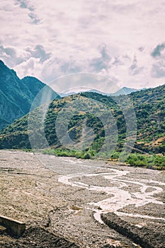 View of mountains Babadag and a muddy river Girdimanchay Lahij yolu from the side in Lahic village, Azerbaijan