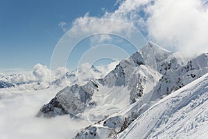 View on mountains and blue sky above clouds