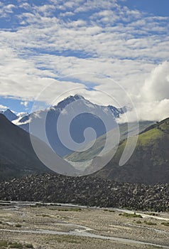 View of mountains covered with clouds from the peak with Bhaga river in Darcha