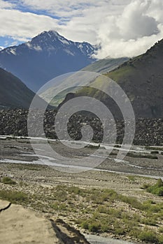 View of mountains covered with clouds from the peak with Bhaga river in Darcha