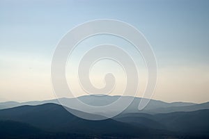 View of mountains in the distance under the horizon photo