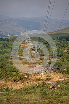 View at the mountains with high voltage electric posts