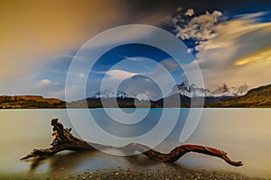 View of the mountains and the lake during the sunrise of Torres del Paine National Park. Autumn in Patagonia, the