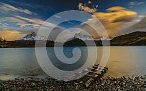 View of the mountains and the lake during the sunrise of Torres del Paine National Park. Autumn in Patagonia, the