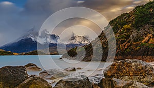 View of the mountains and the lake during the sunrise of Torres del Paine National Park. Autumn in Patagonia, the