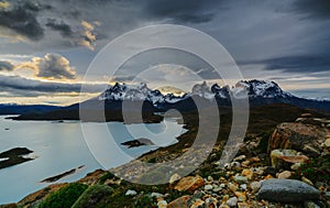 A view of the mountains and the lake during a sunset in the Torres del Paine National Park. Autumn in Patagonia, the