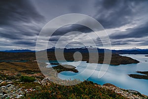 A view of the mountains and the lake during a sunset in the Torres del Paine National Park. Autumn in Patagonia, the