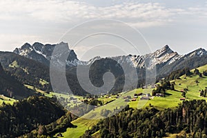 Landscape in Toggenburg with mount Mattstock and Speer in the Swiss Alps, Toggenburg, Canton St. Gallen, Switzerland photo